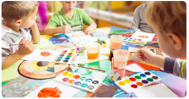 Children at a daycare, participating in a painting activity