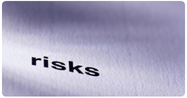 A printed paper with the word "risks" on it
