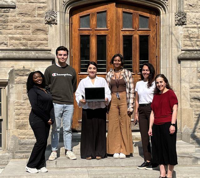 A photo of the SSAGE lab members standing in front of a building at the University of Guelph.