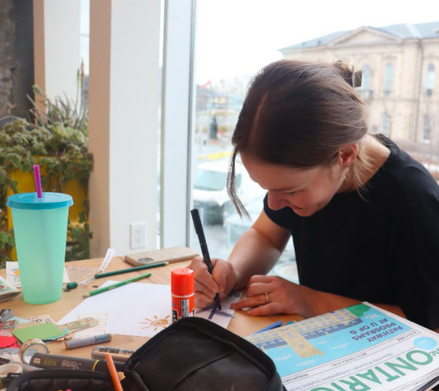 Amy Kipp crafting at 10C, creating material for the SOPR Stories Student Blog.