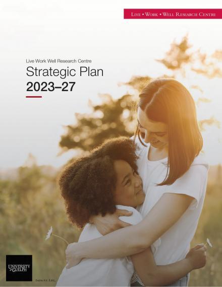 The cover of the Live Work Well Research Centre Strategic Plan 2023-27, showing a young, white-presenting woman with shoulder-length dark hair and a young black girl with thick, curly black hair in a tight embrace. They are smiling broadly at each other and appear to be mother and daughter. They are standing in a meadow, with a single tree and the glow of the setting sun behind them. Both are wearing white short-sleeved shirts, and each is holding a white daisy.